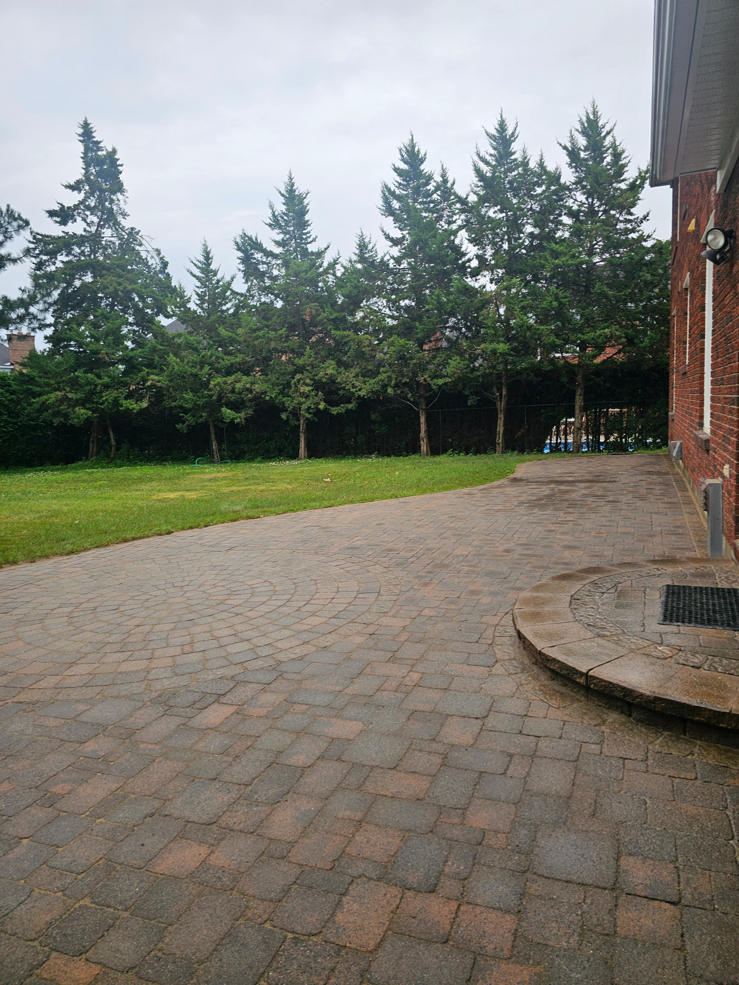 Large back patio pressure wash and re-sanding after